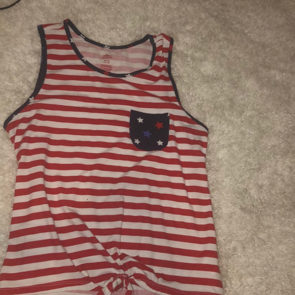 Red stripe shirt with not at the bottom and stars